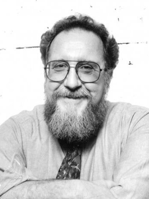 Ron Shiffman smiling on a white backdrop