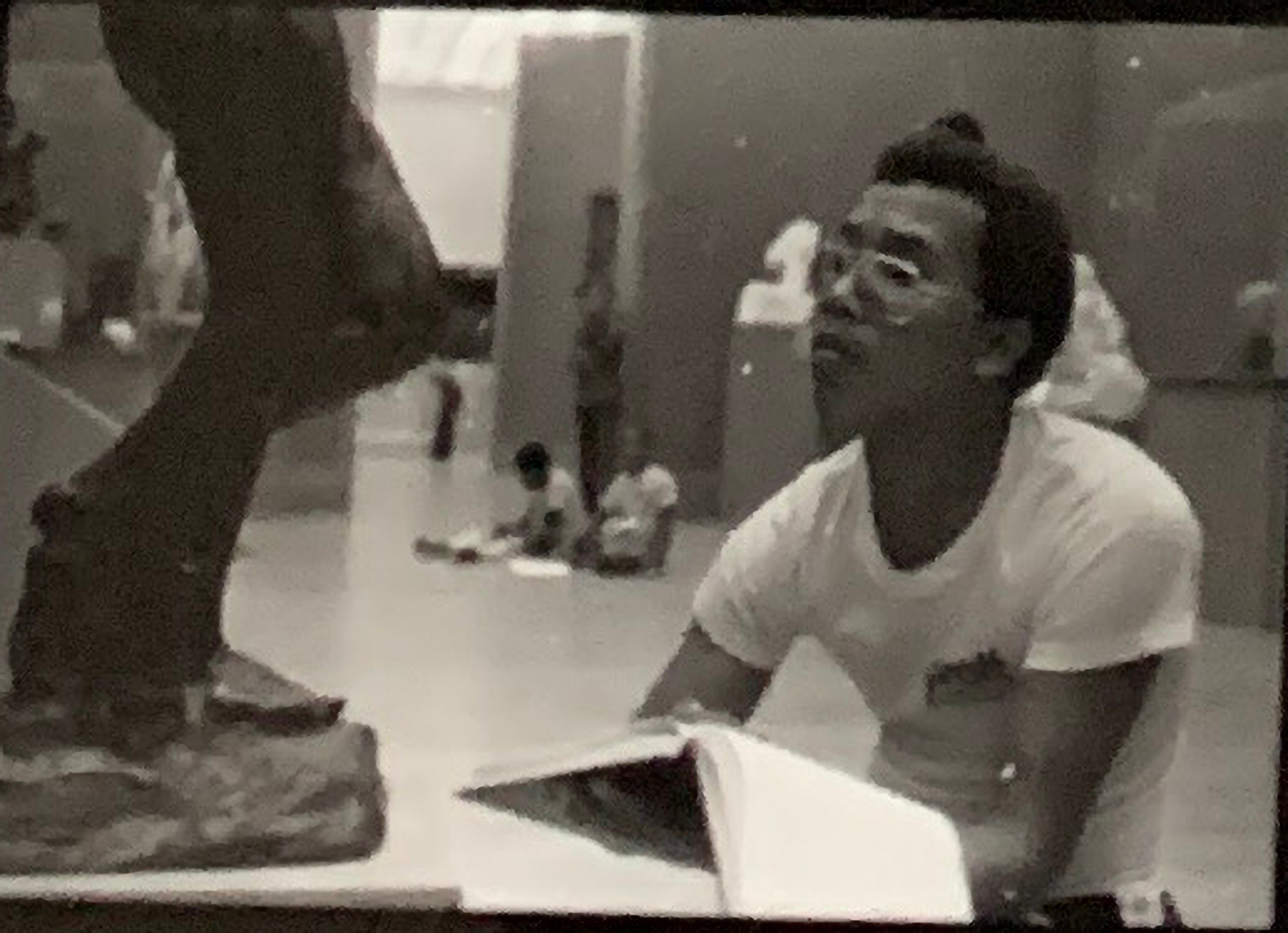 Student sketching in front of a sculpture of a figure at the Metropolitan Museum of Art