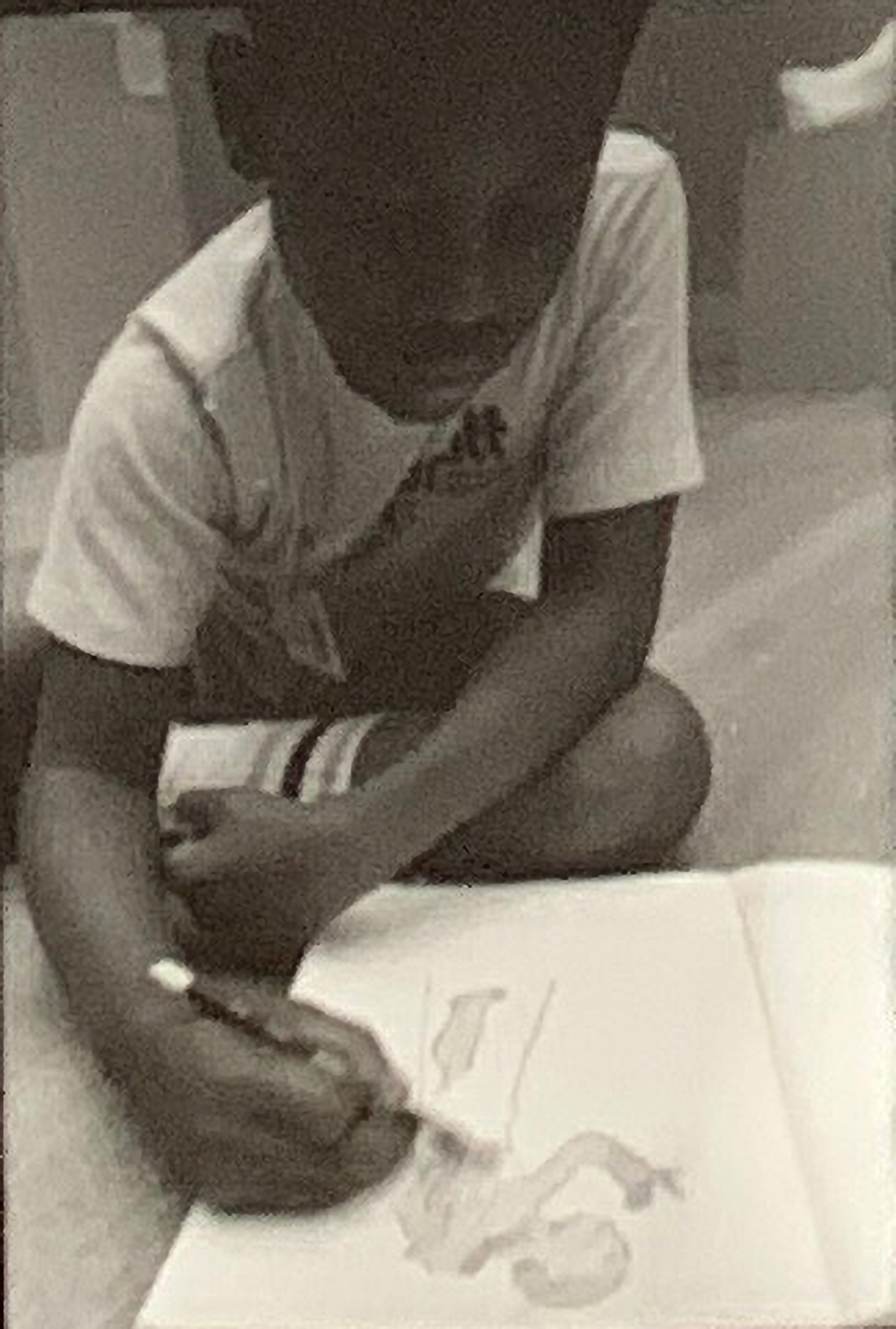 A student sketching a figure