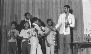 students on stage receiving an award