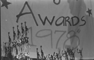 A banner that reads "Awards 1978". In front are a number of sports trophies.