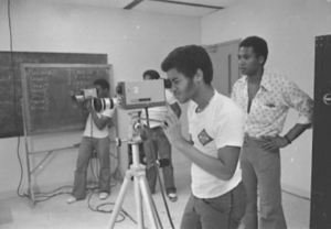 A team of students peering through cameras