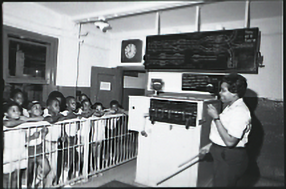 Students looking at a Transit Museum Employee lecturing